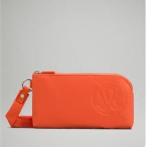 NWOT Lululemon athletica Orange Clutch Wristlet